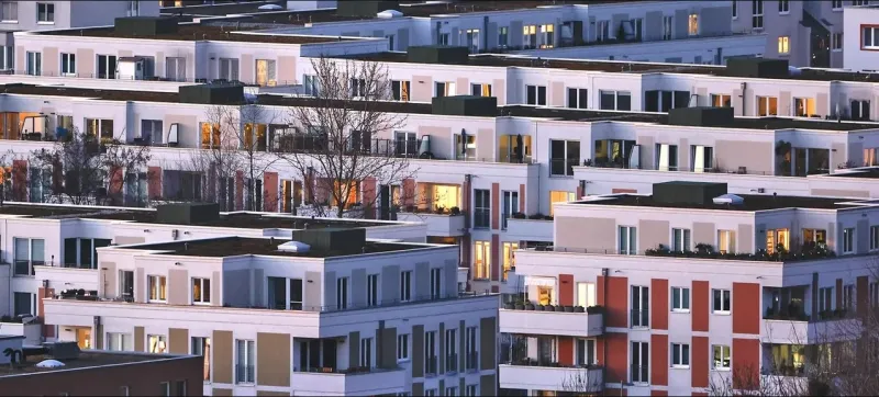 What factors are driving the expected rise in global real estate prices?